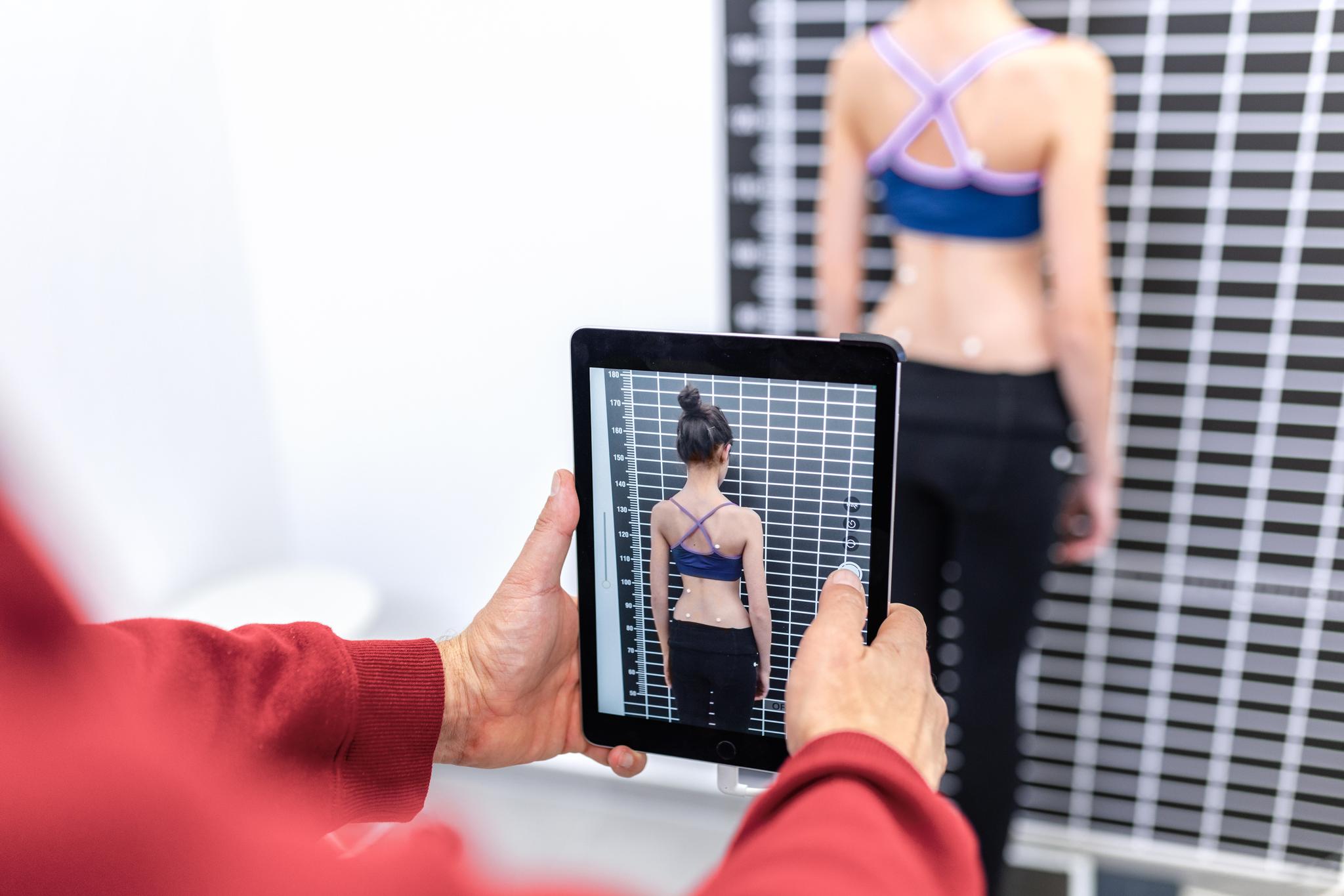 Patient wearing custom Neja scoliosis brace